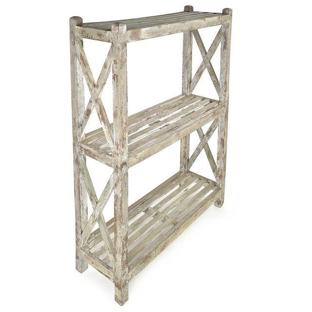 This antique shelf seduces with its architectural silhouette and authentic patina. Made entirely of wood, it offers a...
