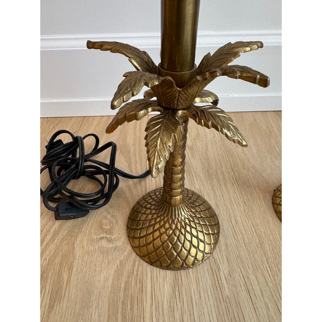 A striking , small but heavy pair of Chapman-attributed vintage cast brass palm tree table lamps, circa 1960s–1970s. Each...