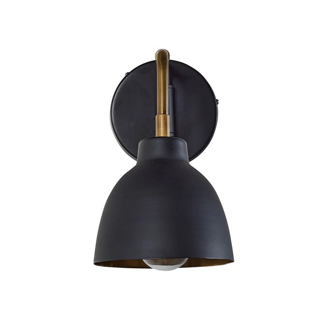 Small midcentury matte black and brass wall sconce. Hardwired.