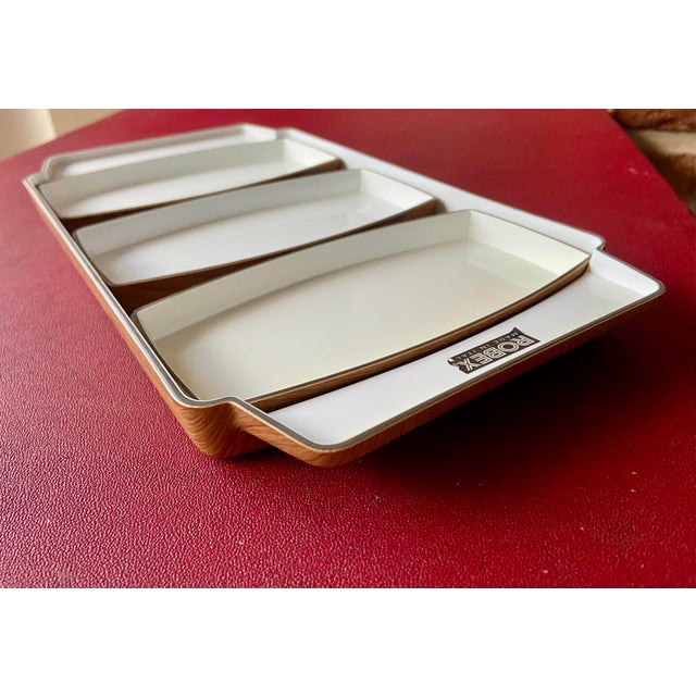 This refined serving set embodies the aesthetic of 1970s Italian modernism, combining functionality with a warm, organic...