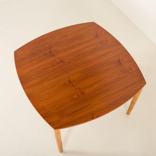 This vintage mid-century teak table was most likely designed by renowned designer William Watting and made by Fristho in...