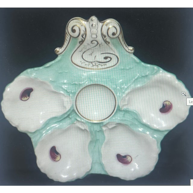 Tiffany blue colored oyster plate made in the late 1870's to 1880's in France by Haviland Limoges. The plate has four...