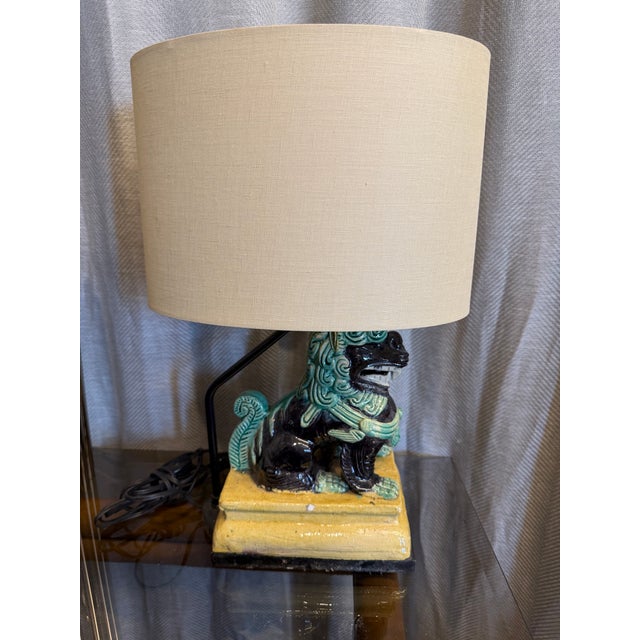 Early 20th Century antique green, blue and saffron yellow terracotta Chinoiserie Foo dog figurine table lamp. Original...