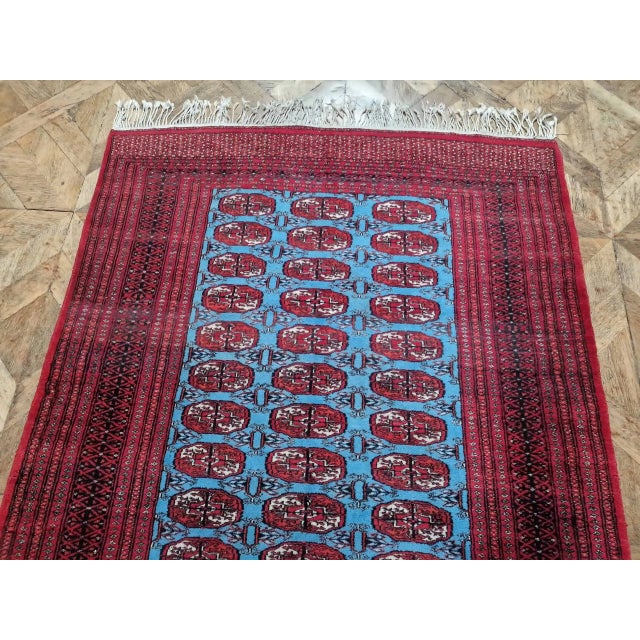 Hand-knotted rug from Lahore, Pakistan with a Turkmen pattern of the Tekke tribe. This pattern, also known as "Bukhara or...
