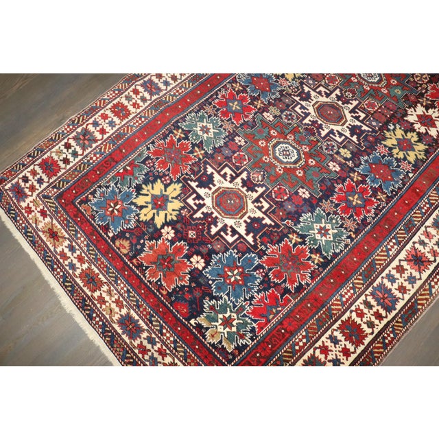 An early 20th century Lesghi Snowflake Pattern Caucasian Rug