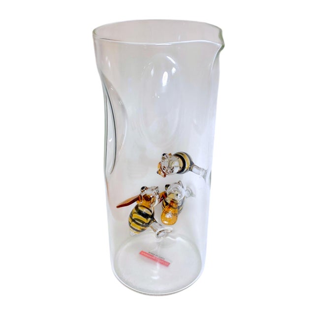 A delightful art glass pitcher with applied handblown bees from Massimo Lunardon for Nieman Marcus. Signed on bottom and...