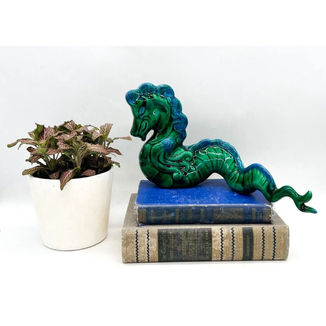 Exquisite ceramic dragon made in the mid-20th century. Brilliantly colored piece of impressive size with an expressive...