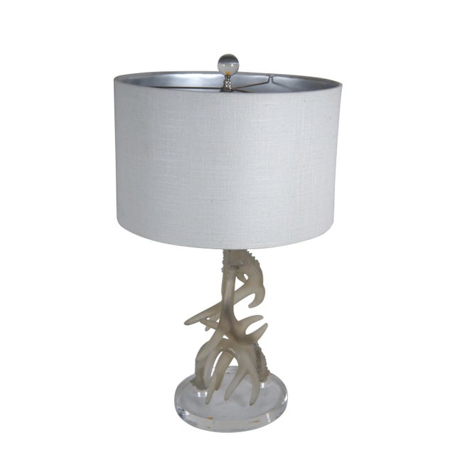 Late 20th century table lamp with round lucite base supporting translucent resin antlers brushed with silver. Includes...
