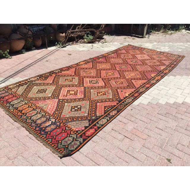 This beautiful vintage handwoven kilim is in fabulous shape. It is approximately 60 years old, handmade of very fine...