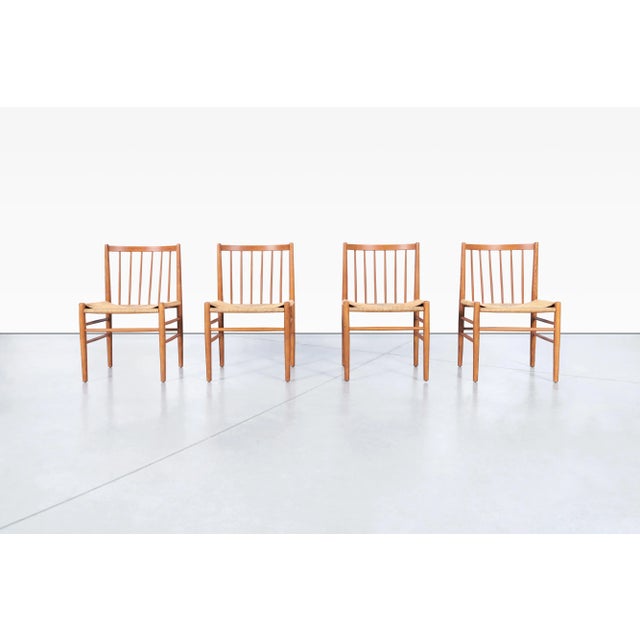 Designed by the celebrated Danish designer Jorgen Baekmark for FDB Mobler, this exceptional set of four Model J80 dining...