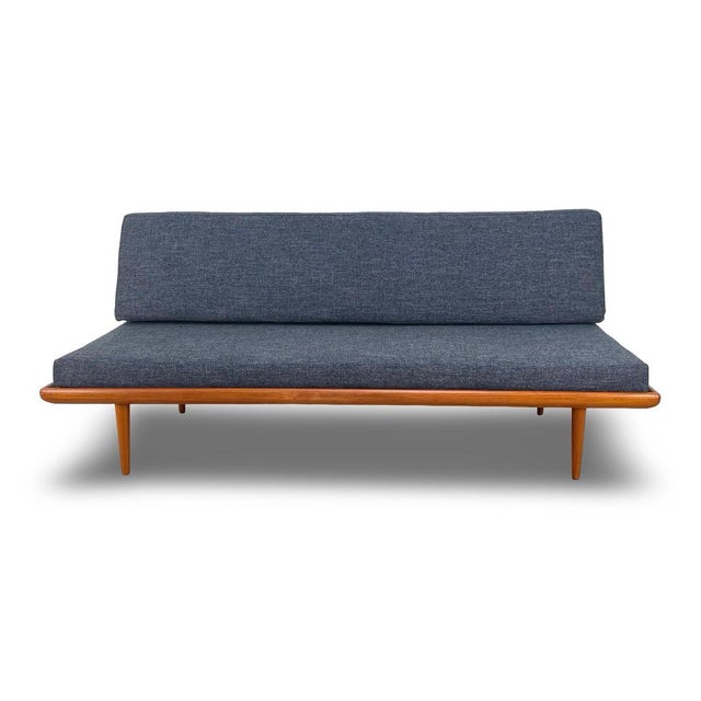 Mid-century vintage teak Danish sofa designed in 1957 by Peter Hvidt and Orla Molgaard and manufactured by France and Son...