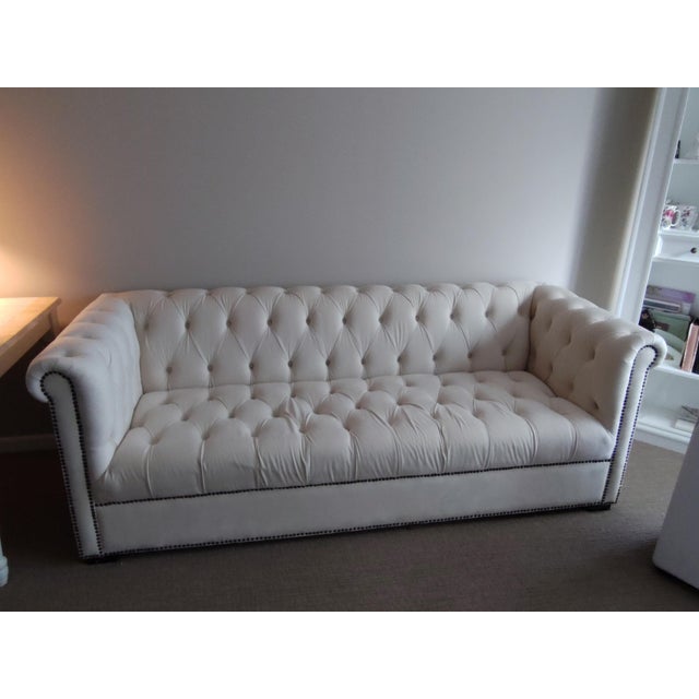 This lovely Chesterfield style sofa is in LIKE NEW CONDITION.... Rarely used..... 75"L x 44"W x 15" from seat to floor....