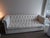 This lovely Chesterfield style sofa is in LIKE NEW CONDITION.... Rarely used..... 75"L x 44"W x 15" from seat to floor....