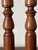 Pair of vintage hand-turned wooden candlestick holders with a warm brown finish and bulbous spindle shapes. 13”h 3/4”...