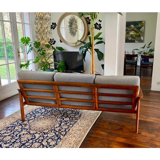 Stunning Scandinavian sofa, Danish-made and dating from the 1960s. It embodies the timeless elegance and craftsmanship...