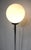 A chrome 1970's space age floor lamp with white glass ball shade, chrome staff and weighted round chrome base. A nice...