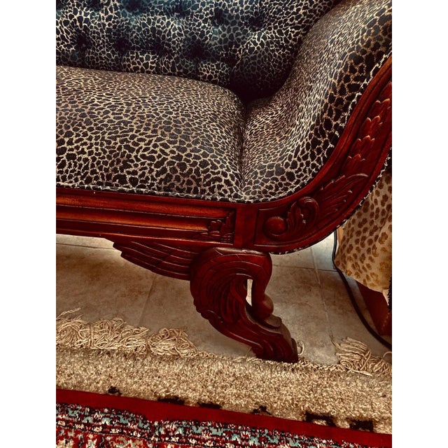 This striking antique-style carved wood and upholstered sofa blends timeless craftsmanship with bold, contemporary...