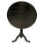 This is a dark oak 19th century tilt-top tripod table. It is round and beautiful with a dark patina oak wooden tripod...
