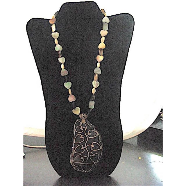 This is part of Chairish’s Costume Jewelry assortment. Stunning shades of black to grey large lustrous mother-of-pearl...