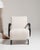 This mid 20th century armchair from Czech Republic is finished in ivory, worked in wood. Its upholstered detailing gives...