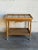 This vintage serving tea table features a striking tile inlay top paired with traditionally sculpted legs. The dynamic...