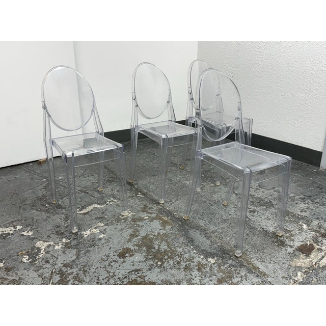 Design Plus Gallery presents a Set of Four in the style of Louis Ghost Side Chairs by Philippe Starck for Kartell. No...