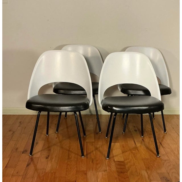 Mid Century Modern Eero Saarinen Model 72C executive side/dining chairs, in a set of four, circa early 1950's. Featuring...