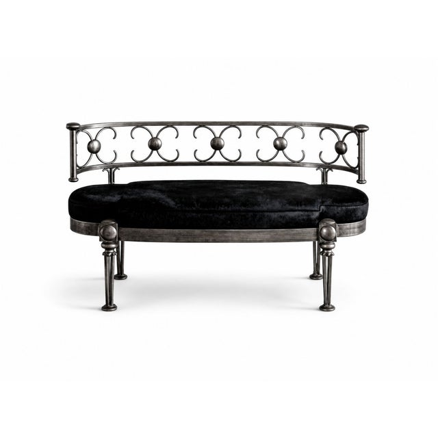 A SPECTACULAR SETTEE: Custom-covered in black cowhide and in excellent condition, this is an early 20th-century French...