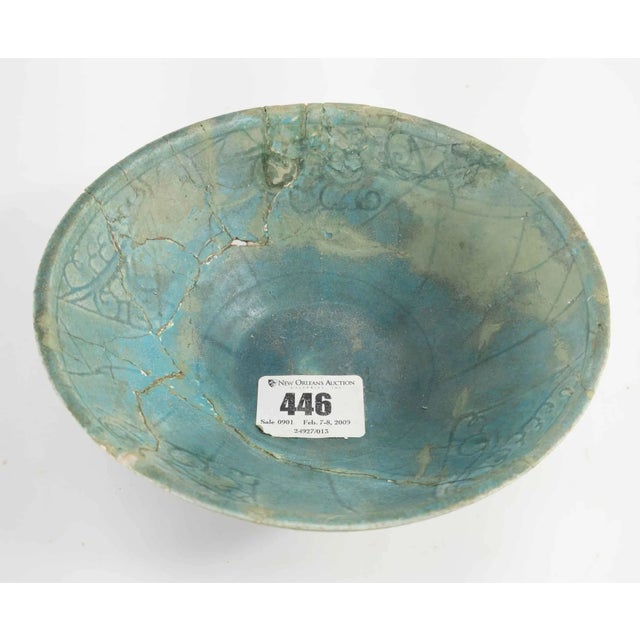 We are selling this great early Persian Kashan bowl. This bright blue-green turquoise glazed bowl has simple incised...