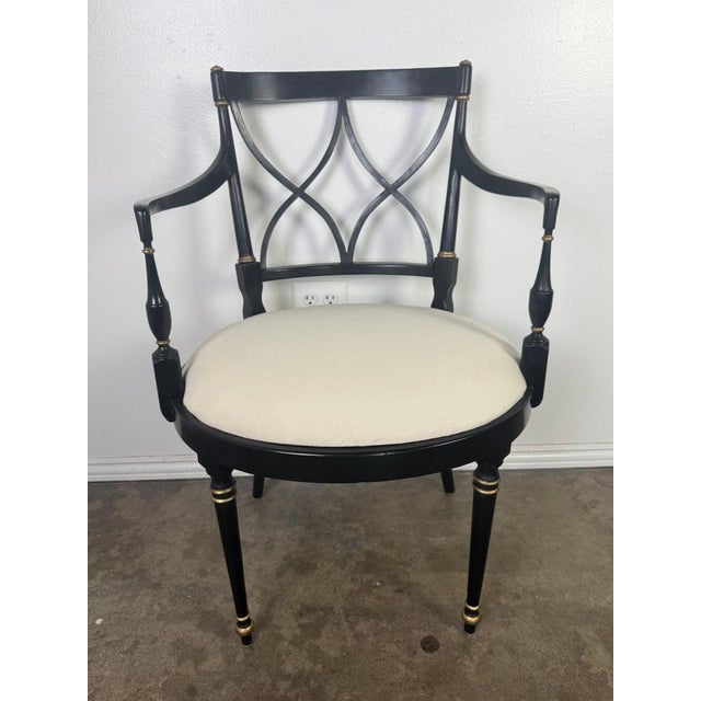 This striking set of ten dining chairs is a modern interpretation of classic Regency and Hollywood Regency design. Crafted...