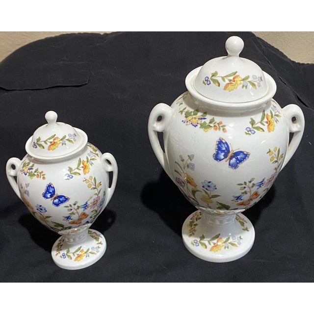 Beautiful set of two vintage Aynsley urns in the beloved Cottage Garden pattern. Crafted from fine English china, each urn...