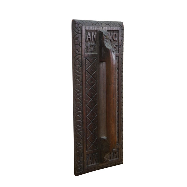 Beautiful hand-carved wooden panel featuring the inscription “Anno 1716”, crafted in a traditional European folk style....