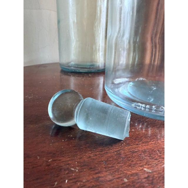 Mid-20th century clear glass reagent / apothecary bottle, originally used in laboratory, pharmaceutical, and chemical...