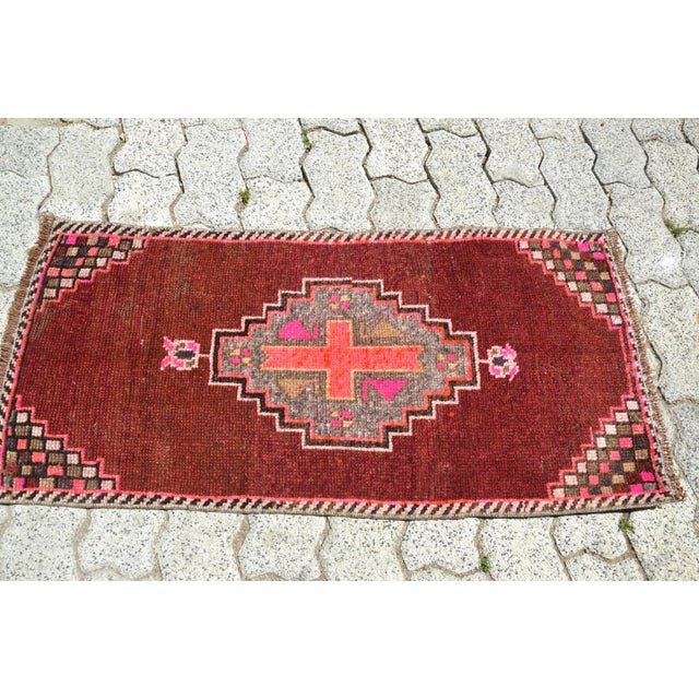 This is a vintage Turkish Oushak rug from the 1960s. The piece was hand-knotted.