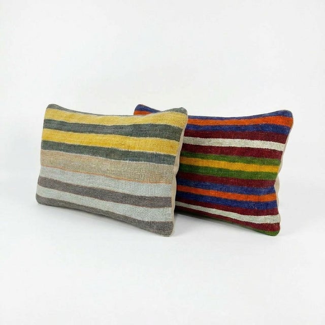 This beautiful 16'' x 24'' pillow cover set was made from authentic Turkish rug pieces. Bright colors of wool adorn the...