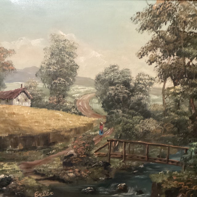 This exquisite piece of artwork portrays a beautiful rural landscape with a cottage, trees, stream and bridge. The...