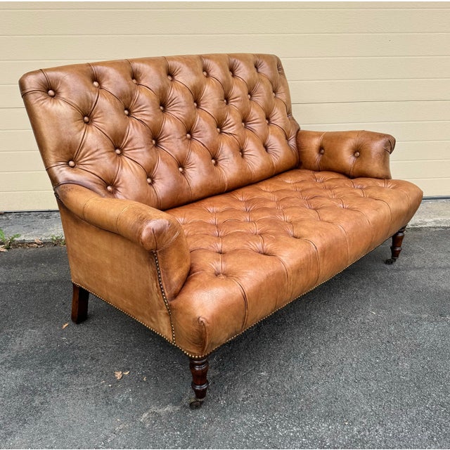 Ralph Lauren Settee/Bench in beautiful tufted camel leather on with turned legs and brass casters.