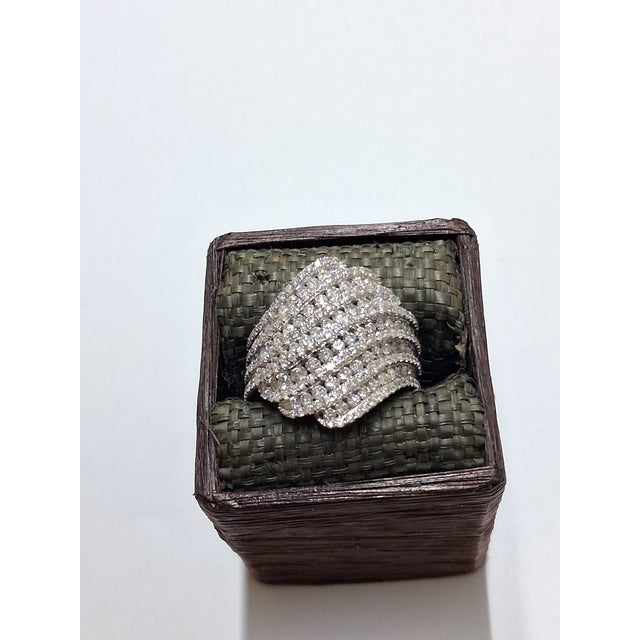 A dramatic statement ring with exceptional presence, this substantial design is crafted in 10K white gold and set with...