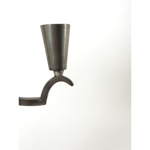 Rare and elegant pair of five-light candelabra produced by Svenskt Tenn in Sweden during the 1930s. These sculptural...