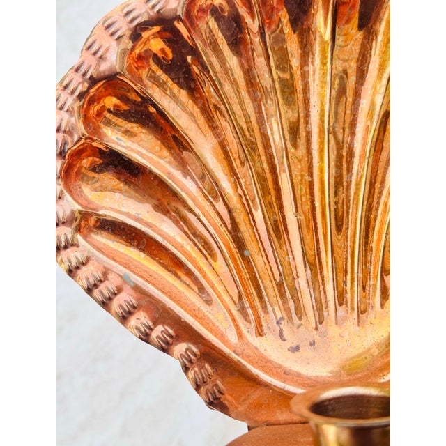 Illuminate your space with coastal charm using this vintage copper shell wall sconce. Shaped like a classic scallop shell...