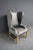 Classic wingback chair attributed to Restoration Hardware. Upholstered in distressed leather with a contrasting fabric...