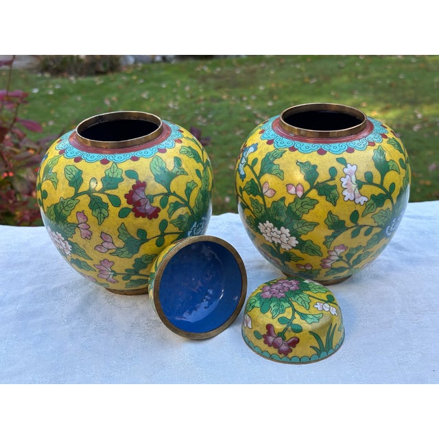 An exceptional, highly decorative pair of authentic Chinese cloisonné enamel lidded ginger jars dating to the Republic...
