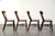 This exceptional set of 4 antique English wooden Windsor farm chairs features a unique design and beautiful colors. A...