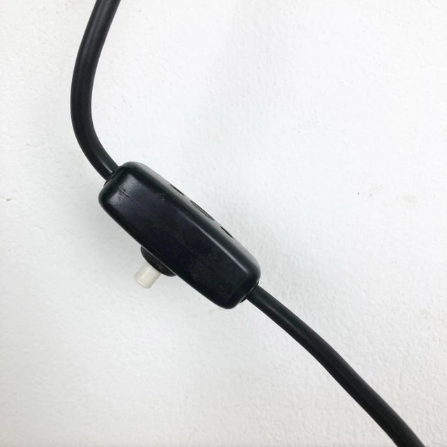 This wall light was designed and produced in Germany in the 1960s. The wall fixation of this light is made of metal with...