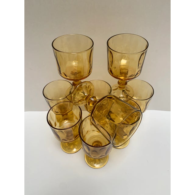 Amber toned glass goblets with textured subtle pattern - set of nine. Perfect for vintage bar ware, water goblets or...