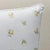 This pillow features Margie Floral. A classic delicate rosebud pattern inspired by a vintage design, Margie Floral is...