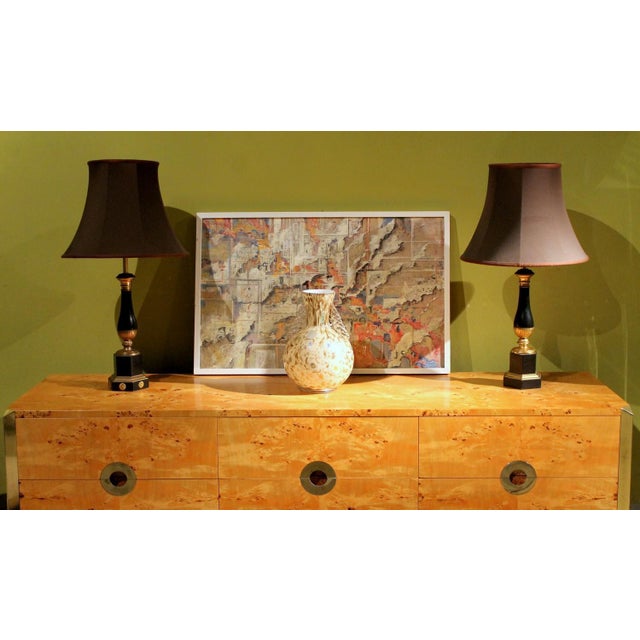 A beautiful pair of french empire style early 20th century black lacquered metal and parcel gilt bronze table lamps with...