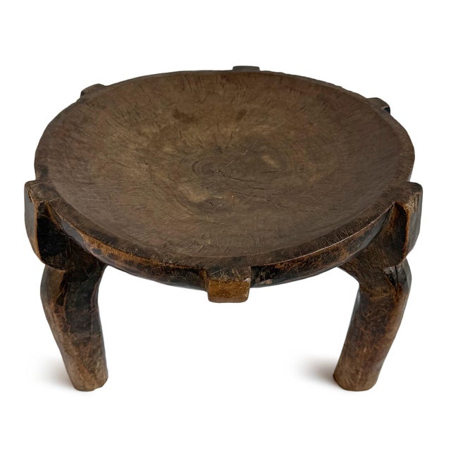 Vintage carved round wood three leg stool from the Hehe tribe of Tanzania. Concave bowl-like surface. Beautiful...