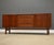 A mid century modern teak sideboard credenza by Nils Jonsson for Troed. Two sliding doors. Professionally refinished....
