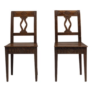 Pair of 19th Century French Chestnut Brown Carved Oak Chairs For Sale